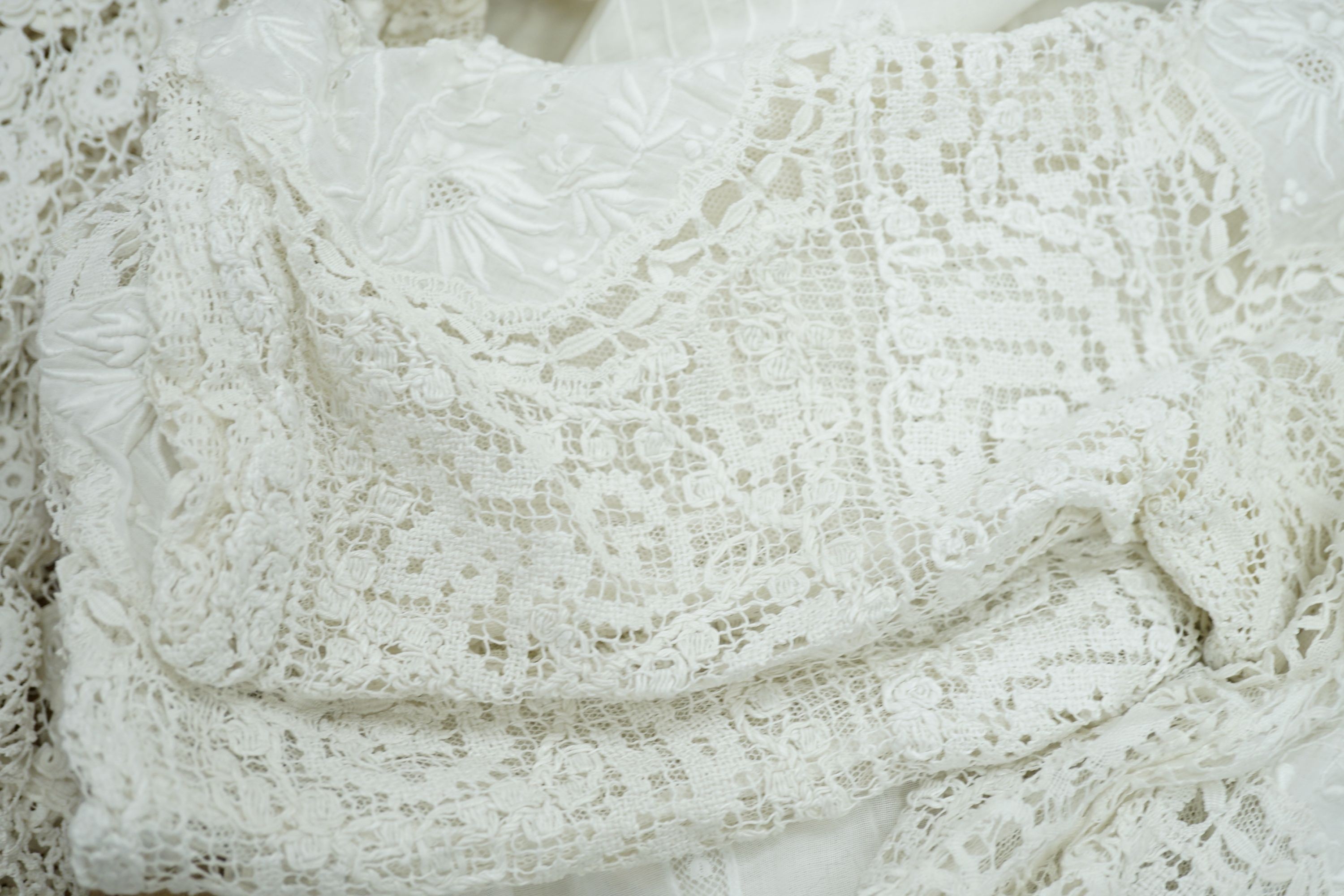 A 19th century hand made Irish crochet jacket, with long sleeves and high collar, a bobbin lace and white worked patch worked blouse, a fine lawn and anglaise worked blouse and a fine bobbin lace trimmed and white worked